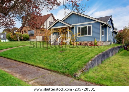 House exterior. View of front yard and small entrance porch