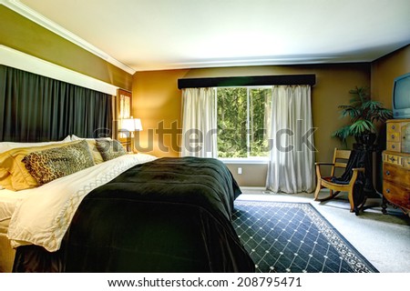 Elegant bedroom with light grey curtains, beautiful bedding with cheetah print pillows