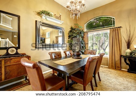 Dining room interior with wooden table and leather chairs