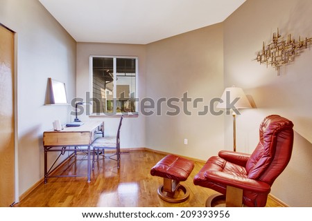 Creamy office room interior with deck and comfortable chair with foot rester