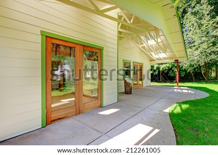 House backyard walkout deck with glass door entrance door
