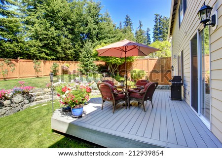 Beautiful landscape design for backyard garden and patio area on walkout deck