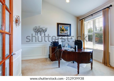 Office room in luxury house with carved wood desk