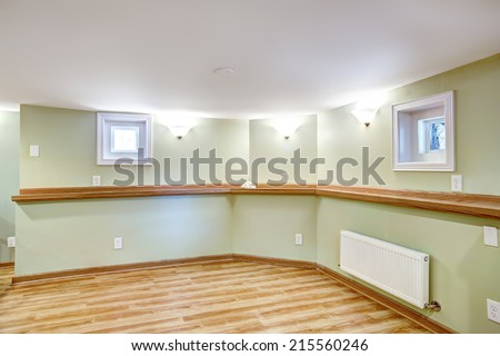 Empty dining area in soft mint color and wood trim. Mother-in-law apartment interior