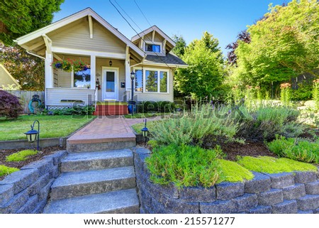 Classic american house exterior. Front yard landscape with tile brick walkway and stairs