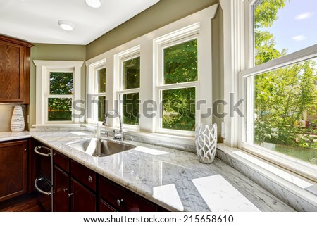 Beautiful kitchen cabinet with marble top and steel sink