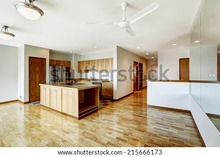 Empty studio. Living room with large mirior and kitchen area. Down town of Seattle
