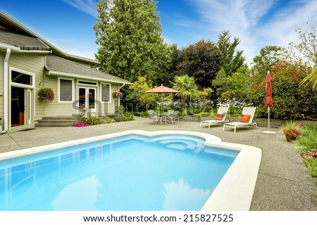 Backyard with swimming pool and patio area.Real estate in Federal Way, WA