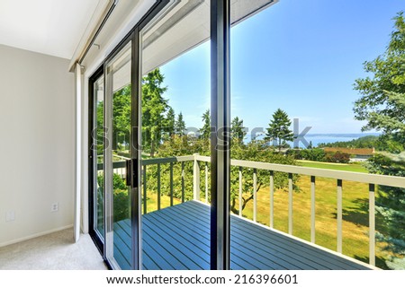 House with water view. Walkout deck with glass slide door
