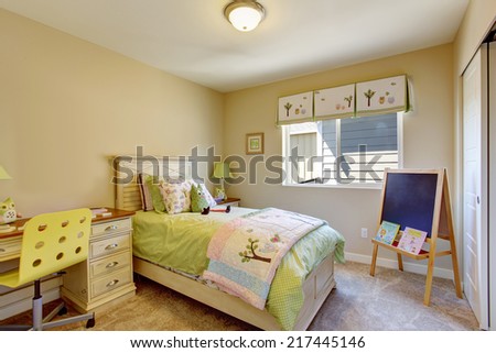 Cheerful bright kids room with chalkboard and desk