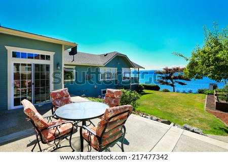 Classic house with curb appeal and water front view. View from patio area. Port Orchard town, WA