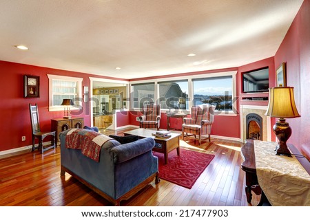 Bright contrast red room with antique furniture and hardwood floor. Real estate in Port Orchard, WA