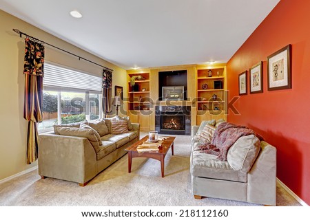 Comfort living room design. Bright contrast color walls, beige carpet floor, comfortable sofas and coffee table