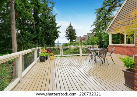 Patio and sitting area on spacious walkout deck overlooking bay