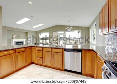 Luxury kitchen room with bright brown cabinets and built-in appliances