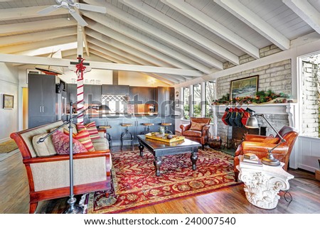 Holiday winter decor living room interior with white vaulted wood ceiling.