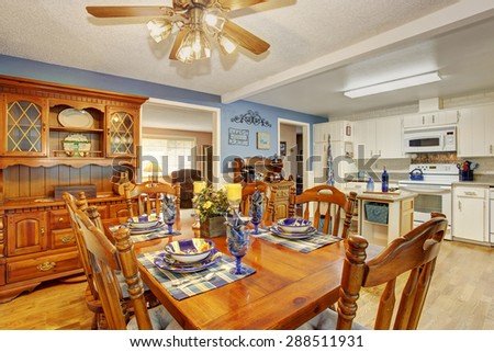 Beautifully decorated dinning room with sliding glass door and dinning set.