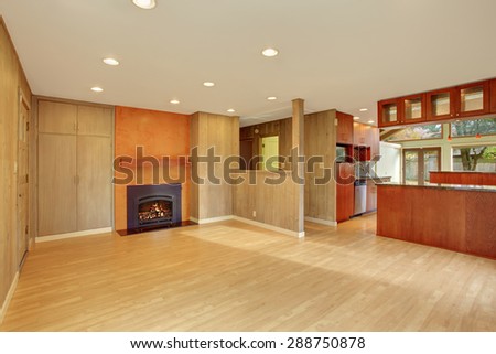 Nice living room with hard wood floor and fireplace. Cherry wood kitchen with open floor plan.