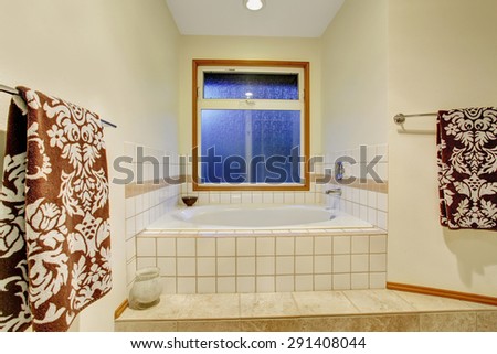 Nice master bathroom with jacuzzi tub and tile floor.