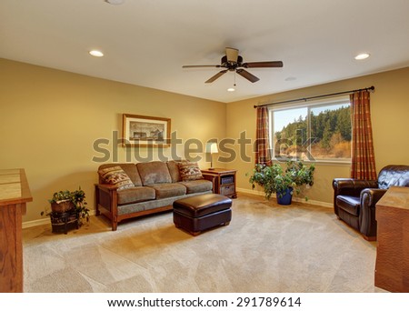 Large family room with sofa and carpet.