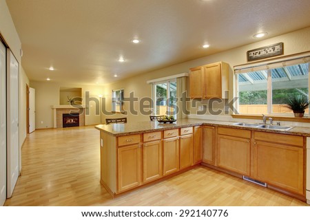 Traditional kitchen with hardwood floor and windows.