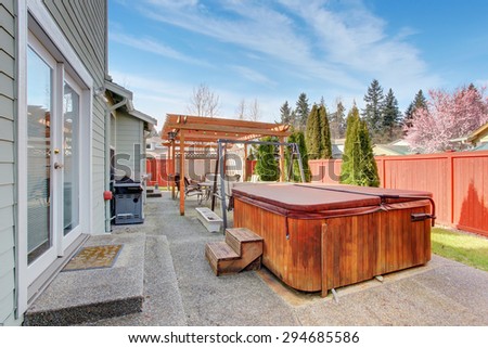 Perfect back yard including furnished patio with hot tub.