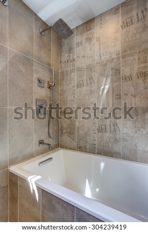 Unique bathroom shower wall with writing.