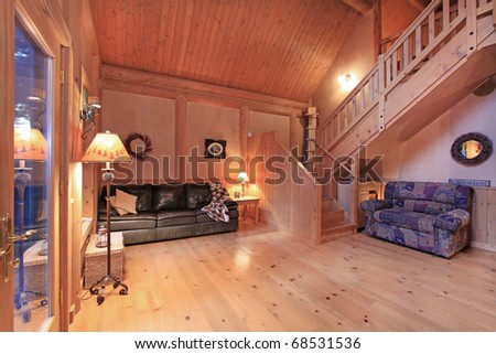 Log cabin living room in the evening light