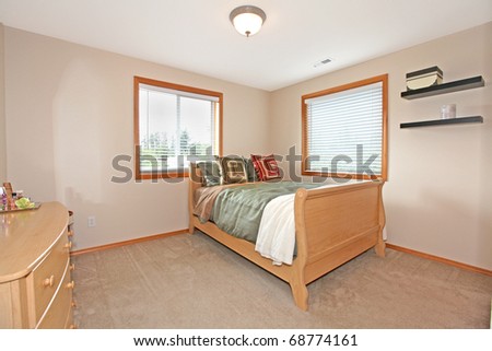 Bedroom with light and simple furniture.
