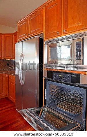 Kitchen with cherry cabinets and grey granite