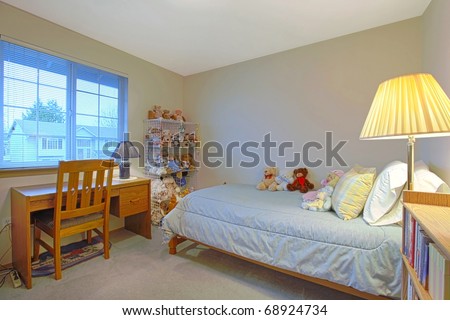 Kids bedroom with toys on the bed
