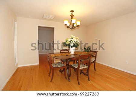 Dining room with  table and chairs in an empty house