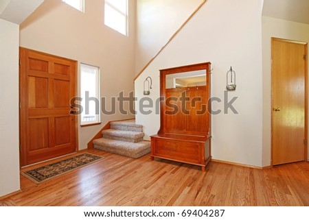 large open entrance with beautiful wood doors