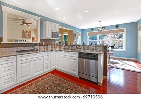 Kitchen white with cherry floor and blue walls