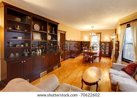 Gold luxury living and dining room with mahogany wood