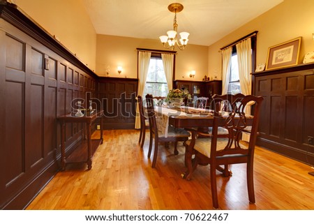 Luxury dining room with mahogany and gold