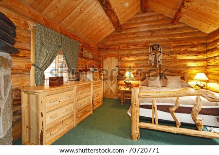 Log Cabin with large furniture and rustic feel.