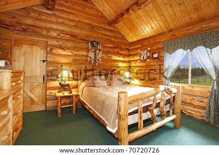 Log cabin bedroom with rustic wood design
