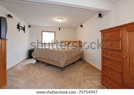 Simple bedroom with one bed and dresser