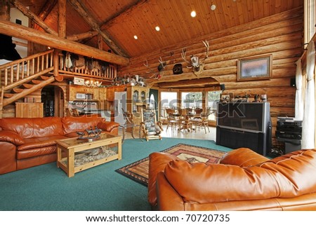 Large living room of the log cabin with cowboy style