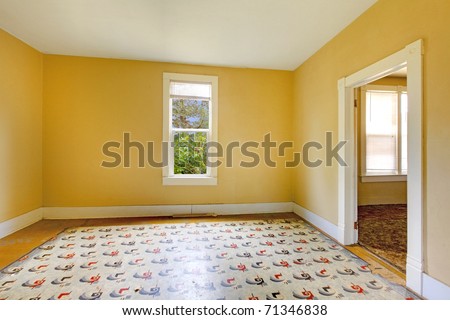 Old empty yellow room. Build in 1907 old farm house in Ashford, Washington State near Mt. Ranier.