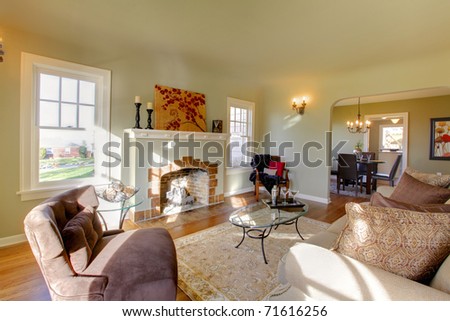 Luxury cozy living room. Green walls, beige tones and cozy craftsman style. Tacoma, WA