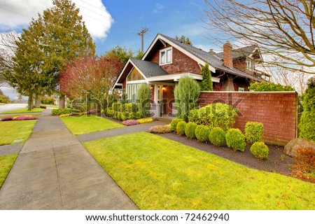 Spring exterior house with brown walls during Northwest spring. Tacoma, WA