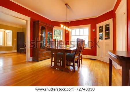 Classic red dining room with antique furniture
