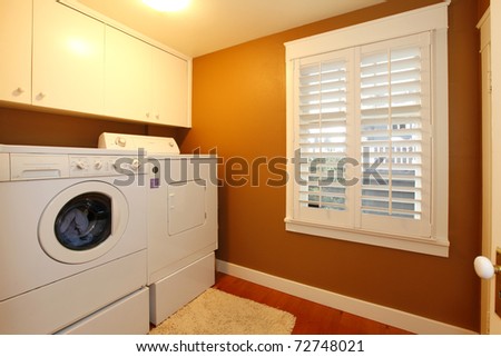 Laundry room with gold colors