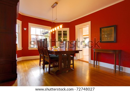 Classic red dining room with antique furniture