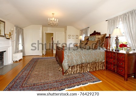 Master bedroom with fireplace and beautiful antique furniture. Luxury old home in Tacoma, WA.
