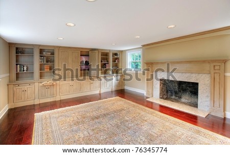 Luxury large room with cherry mahogany hardwood floor and custom made cabinets with entertainment center. Basement in a historical luxury home in Tacoma, WA