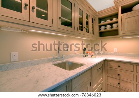 Luxury custom build small kitchen in the basement room for entertainment.