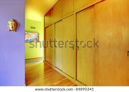 Bright and colorful hallway with lots of closets